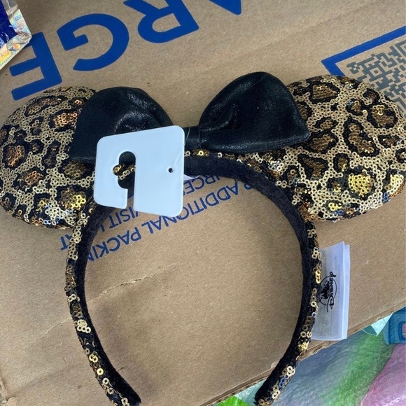 Minnie Mouse Sequined Leopard Print Ear Headband with black sparkly Bow